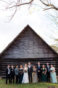 Entire wedding party poses during a fall London Town wedding photography session.