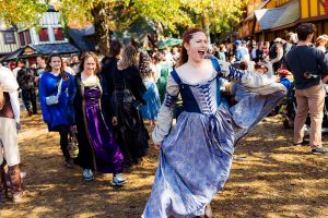 Bride dances a renaissance faire.