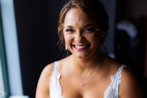 Window-lit portrait of the bride in the Hampton Inn Baltimore-Downtown-Convention Center.