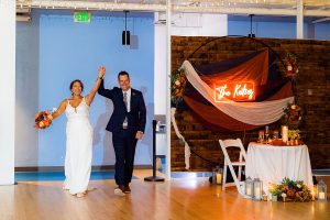 Bride and groom enter their reception space at the AVAM in Baltimore.