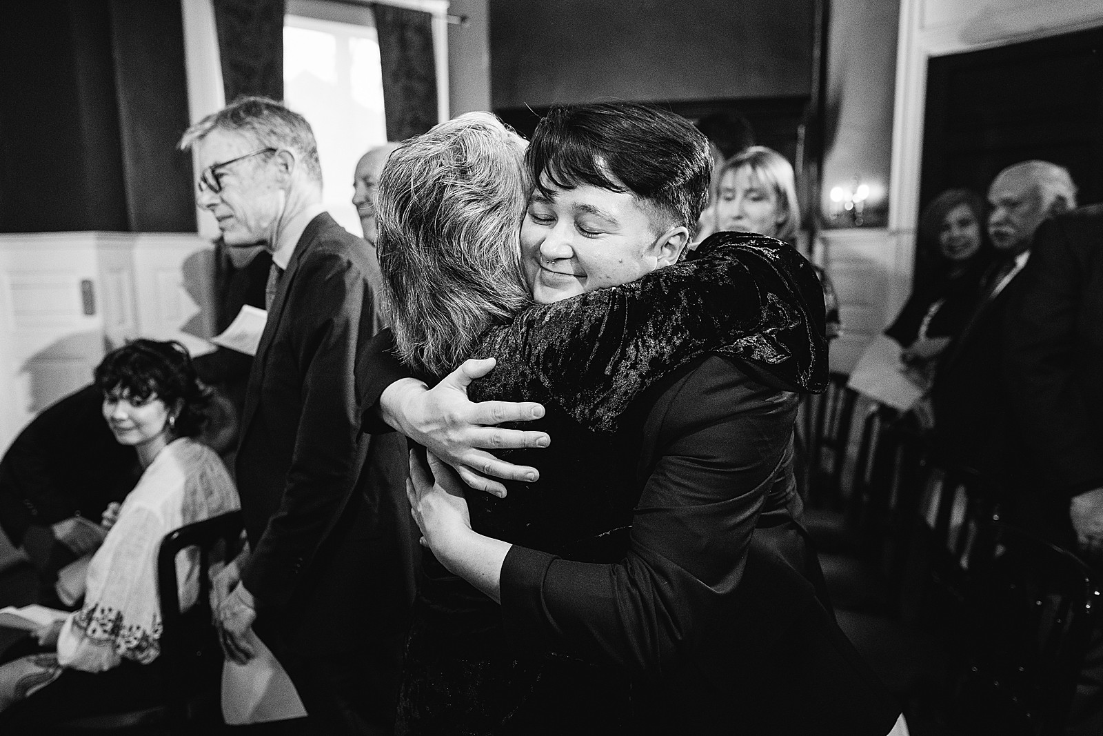 Mom hugs her child in happiness after just getting married. 