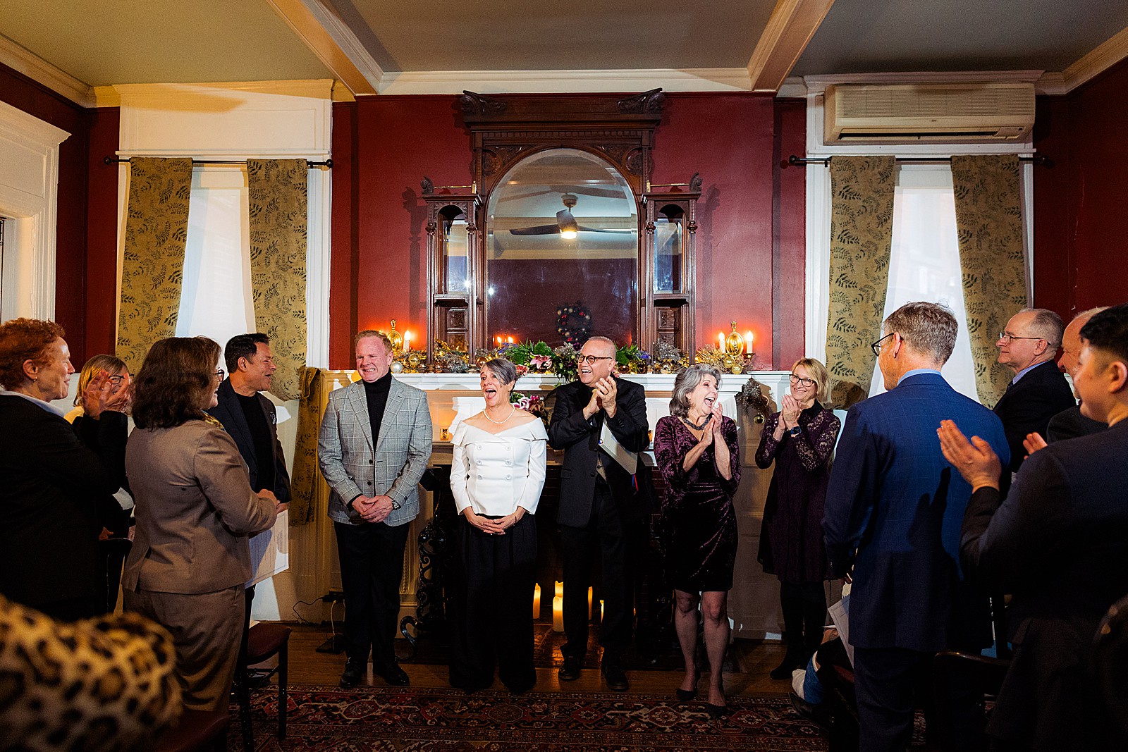 Two brides look happy and excited during their ceremony at the Tabard Inn in DC. 