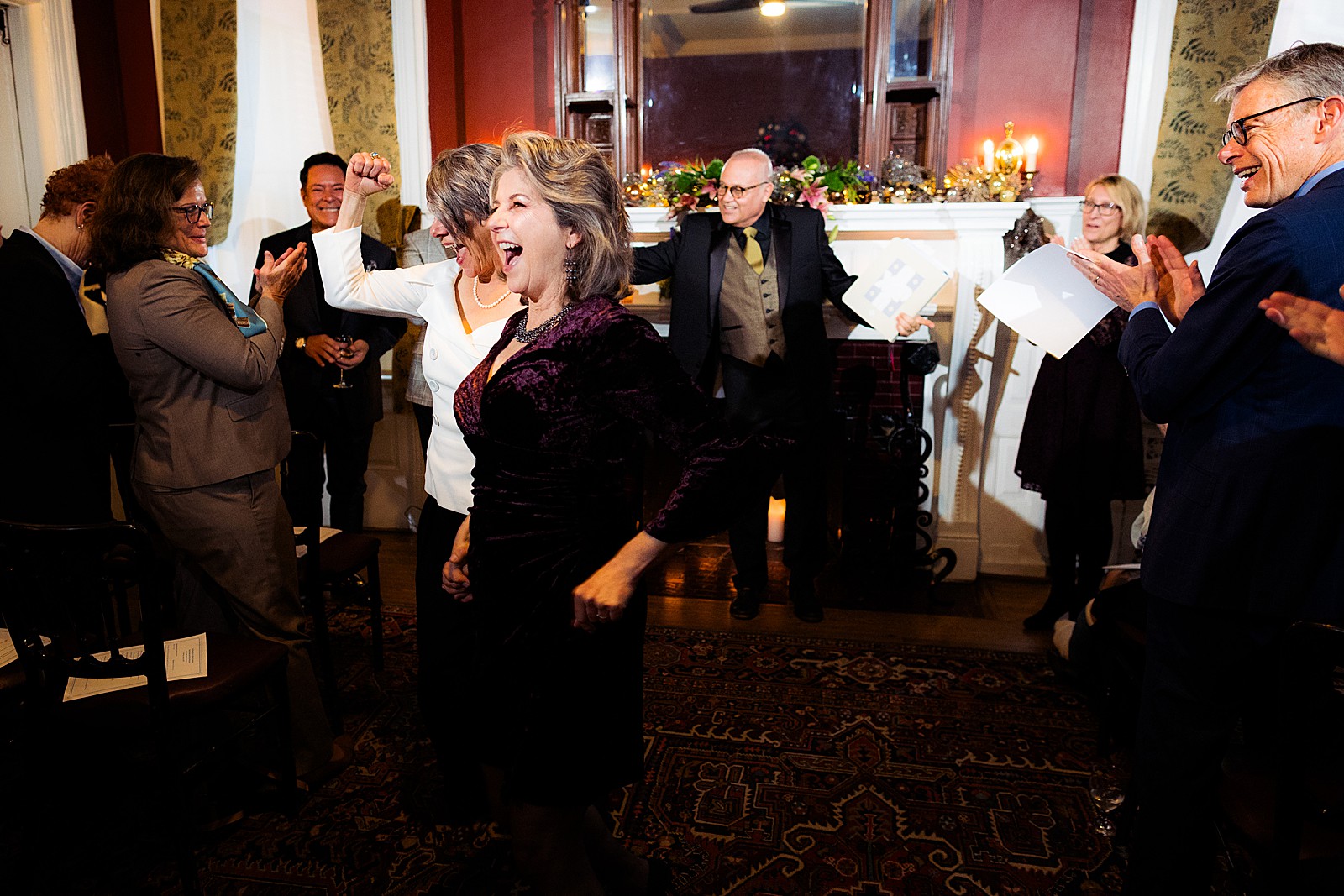 Bride pumps her fist while walking out of her ceremony. 