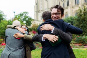 Hugs after a micro wedding at Bishop's Garden in DC.